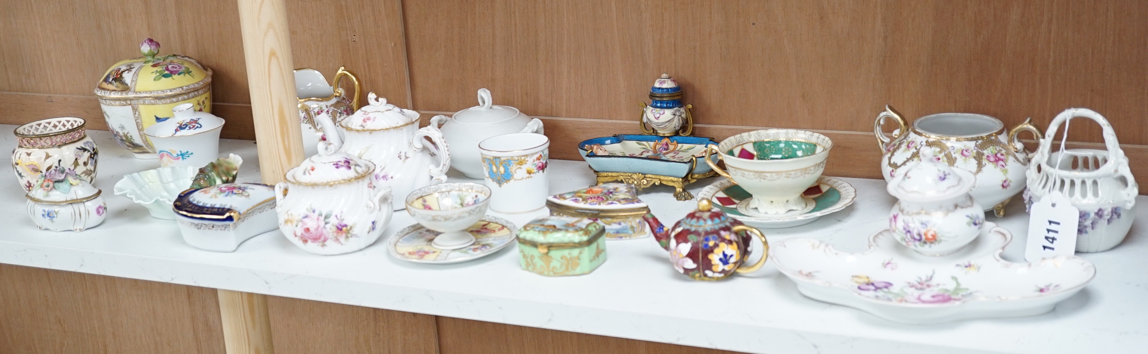 A large group of continental ceramics to include mainly 19th century including one piece of Zsolnay, Dresden wares, trinket boxes, a pottery and gilt metal mounted inkstand etc